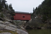 One of the many covered bridges in the Acadia region, spanning the Wolf river in Fundy National Park, New Brunswick